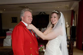Wedding Toastmaster in Essex Richard Palmer having his Bowtie adjusted by the Bride