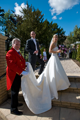 Essex Wedding Toastmaster with bride and bridegroom, holding Lucy's Wedding Dress 
